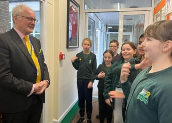 Headteacher Nic York, Clive Jones MP and Deputy Head Chloe Liddiard outside of Emmbrook Junior School. Image: Office of Clive Jones.