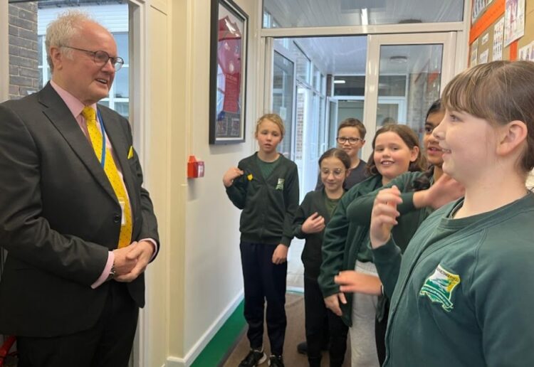 Headteacher Nic York, Clive Jones MP and Deputy Head Chloe Liddiard outside of Emmbrook Junior School. Image: Office of Clive Jones.
