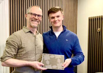 Rodger and lucky prize draw winner Sam Methold celebrate Rodger Duckworth Physiotherapy's 30th anniversary. Picture: Emma Merchant