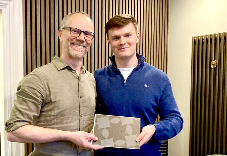 Roger and lucky prize draw winner Sam Methold celebrate Roger Duckworth Physiotherapy's 30th anniversary. Picture: Emma Merchant