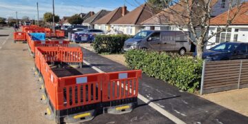 The newly created active travel path for cyclists and pedestrians outside homes in Woodlands Avenue for the Woodley to Reading active travel route. Credit: Wokingham Borough Council