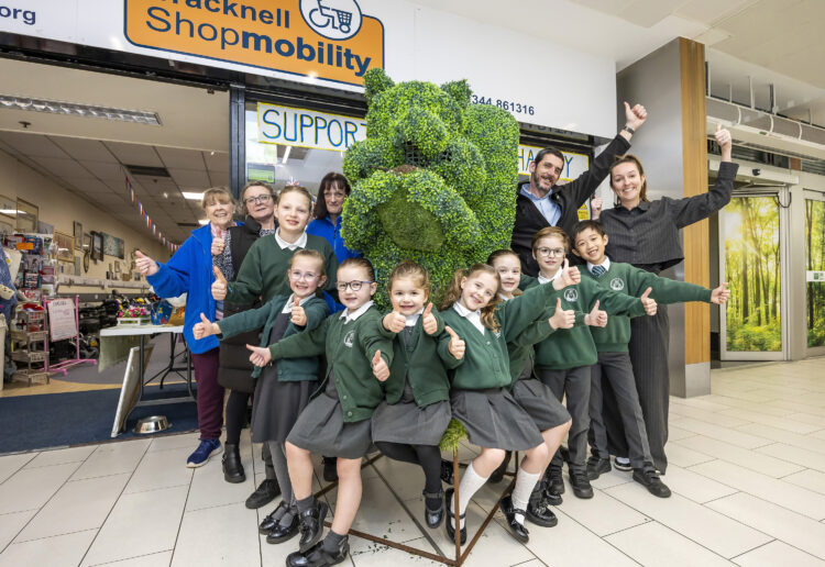 Pictued are: team members from Shopmobility, children representing Winkfield St Mary's CE Primary, Mick Conway, environmental services manager at The Lexicon, Rachel Tomkins, headteacher at Winkfield St Mary's CE Primary School.. Pic: Stweart Turkington.