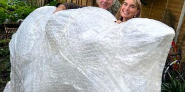 Charlie Mackesy (here with Dr Rachael de Caux) will design and hand-paint one of Thames Hospice's Trunks across the Thames elephant sculptures. Picture: Thames Hospice