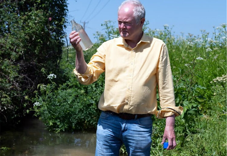 Clive Jones examines water quality. Pic: Supplied.
