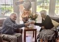 Graham and Barbara celebrated 70 years together, with a cake and flowers, at Farley Gardens Care Home. Picture: Farley Gardens