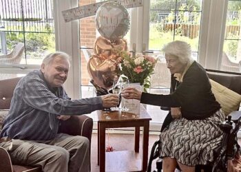Graham and Barbara celebrated 70 years together, with a cake and flowers, at Farley Gardens Care Home. Picture: Farley Gardens