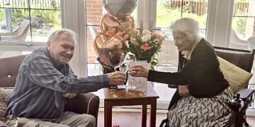 Graham and Barbara celebrated 70 years together, with a cake and flowers, at Farley Gardens Care Home. Picture: Farley Gardens