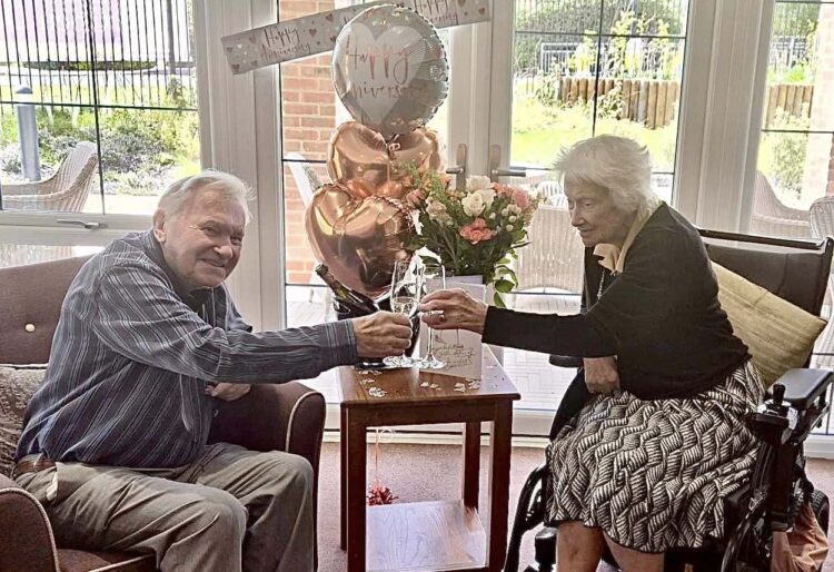 Graham and Barbara celebrated 70 years together, with a cake and flowers, at Farley Gardens Care Home. Picture: Farley Gardens