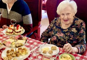 Cicely feels more 39 than 93 as she celebrates at Westende with friends. Picture: Emma Merchant