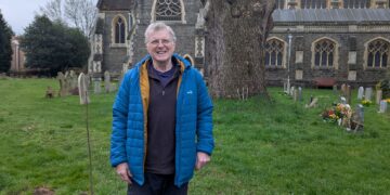 Andy Clark with the new St Paul's Church rowan and the stump of the Cedar of Lebanon. Picture: St Paul's Church