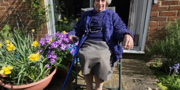 Betty Cave - 95 with her home grown Violet Senetti which will have to be removed.