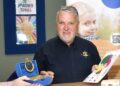 Peter Hopkins from Berkshire Freemasons being shown some of the work and therapeutic aids used in sessions by Martin, a BB4K Support Worker. Picture BF