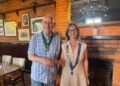 Town Mayor Cllr Alwyn Jones was presented with honorary membership of the club. Here with new Lions president Jennifer Rawsthorn. Picture: Wokingham Lions