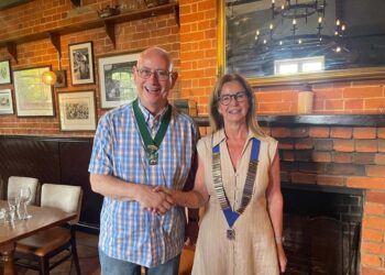 Town Mayor Cllr Alwyn Jones was presented with honorary membership of the club. Here with new Lions president Jennifer Rawsthorn. Picture: Wokingham Lions