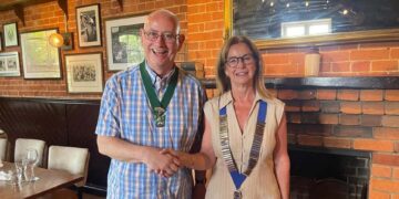Town Mayor Cllr Alwyn Jones was presented with honorary membership of the club. Here with new Lions president Jennifer Rawsthorn. Picture: Wokingham Lions