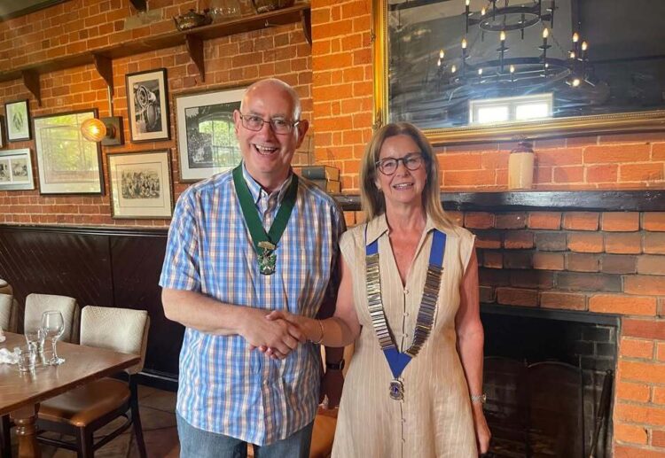 Town Mayor Cllr Alwyn Jones was presented with honorary membership of the club. Here with new Lions president Jennifer Rawsthorn. Picture: Wokingham Lions