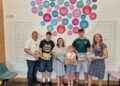 Isabella, centre, with support from her family, has provided acts of kindness bags for the Spires Cleft Centre. Picture: Waistell family and Spires Cleft Centre.