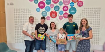 Isabella, centre, with support from her family, has provided acts of kindness bags for the Spires Cleft Centre. Picture: Waistell family and Spires Cleft Centre.