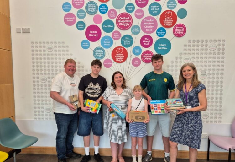 Isabella, centre, with support from her family, has provided acts of kindness bags for the Spires Cleft Centre. Picture: Waistell family and Spires Cleft Centre.
