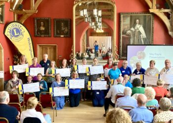 Wokingham Lions had much to celebrate at their Town Hall event. May Fayre stallholders receive donations. Picture: Emma Merchant