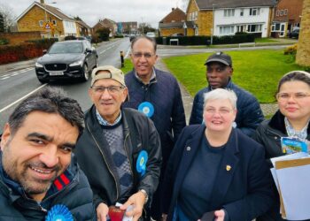 Councillors Pauline Jorgensen, second from right, and Moses Iyengumwena, both Conservative councillors for Hillside ward, are petitioning for a solution for parking during matchdays in Lower Earley. Credit: Pauline Jorgensen.