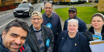 Councillors Pauline Jorgensen, second from right, and Moses Iyengumwena, both Conservative councillors for Hillside ward, are petitioning for a solution for parking during matchdays in Lower Earley. Credit: Pauline Jorgensen.