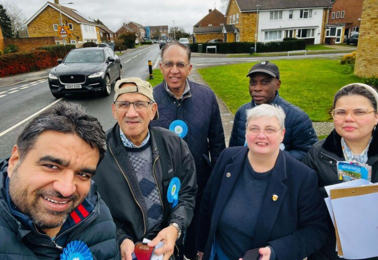 Councillors Pauline Jorgensen, second from right, and Moses Iyengumwena, both Conservative councillors for Hillside ward, are petitioning for a solution for parking during matchdays in Lower Earley. Credit: Pauline Jorgensen.