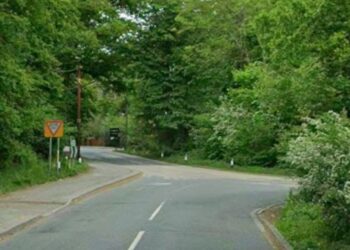 Peacock Lane turns into Old Wokingham Road at a bend, with a T-junction for Waterloo Road.