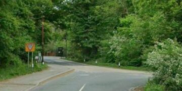 Peacock Lane turns into Old Wokingham Road at a bend, with a T-junction for Waterloo Road.