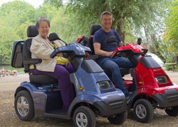 Cllrs Beth Rowland and Mark Ashwell tried out two new mobility scooters at Dinton Pastures. Picture: Rob Cadwell