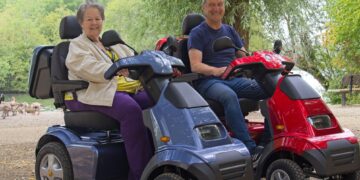Cllrs Beth Rowland and Mark Ashwell tried out two new mobility scooters at Dinton Pastures. Picture: Rob Cadwell