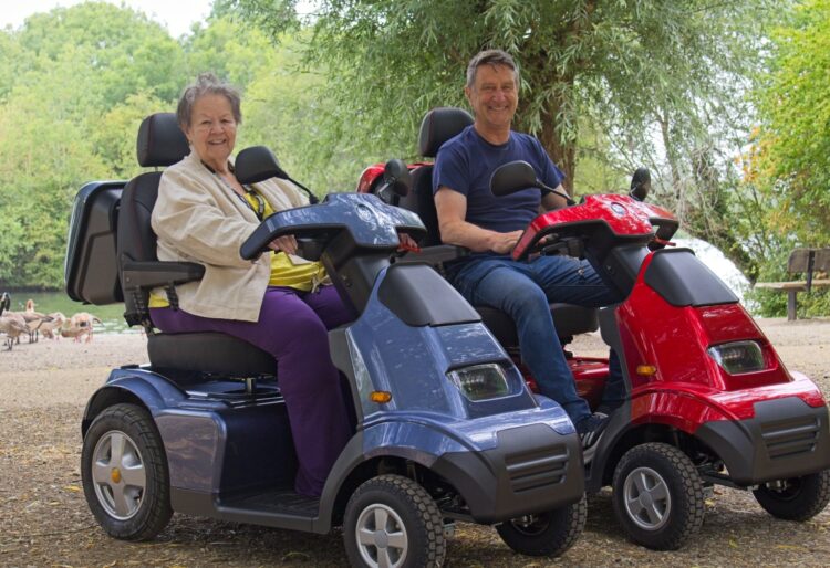 Cllrs Beth Rowland and Mark Ashwell tried out two new mobility scooters at Dinton Pastures. Picture: Rob Cadwell