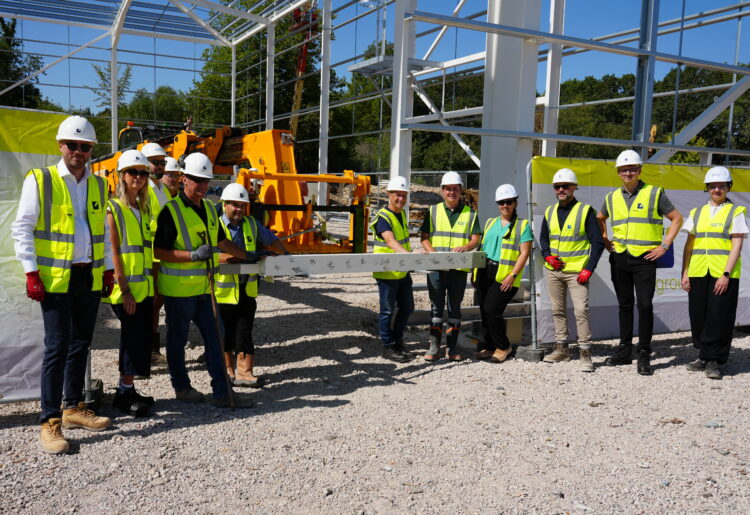 steel signing ceremony on site as part of the completion of the first structural steel frame.