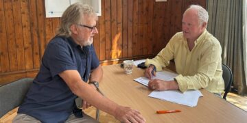 Clive Jones MP speaking to a constituent.