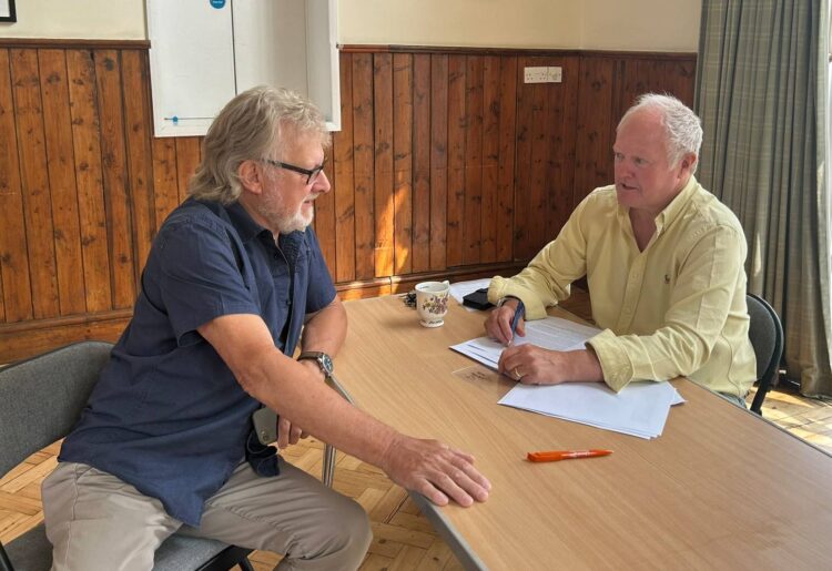 Clive Jones MP speaking to a constituent.