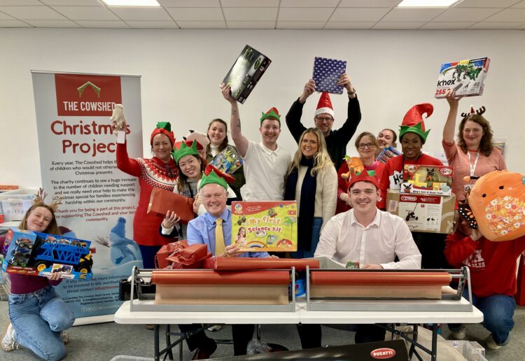 Wokingham MP Clive Jones helped wrap children's Christmas presents at The Cowshed. Picture: Emma Merchant
