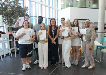 T Level Health students celebrate their success with teacher Wendy Williams.  Picture: Wokingham & Bracknell College