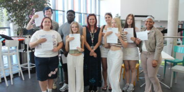 T Level Health students celebrate their success with teacher Wendy Williams.  Picture: Wokingham & Bracknell College