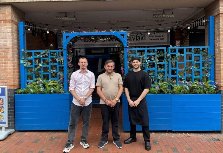 Luftar Rusta, centre, with team members Emilian Rusta and Xhulian Leka at Tasty Greek Souvlaki at Market Place in Reading town centre. Credit: James Aldridge, Local Democracy Reporting Service