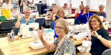 Volunteers at The Cowshed prepare items for people in crisis, just one of the charity's community activities. Picture: Emma Merchant